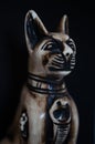 Egyptian black bastet cat figurine on black background Royalty Free Stock Photo