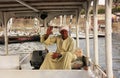 Egyptian captain driving his boat on the Nile river, Luxor