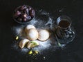 Arabic cookies Maamoul with dates and cup of tea on a black background. Ramadan sweets background.