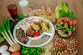 Egyptian Dynamite breakfast platter with flafel, marinated fried eggplant, omelette, hummus, foul, beans, pita bread, salad and