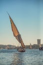 Egyptian Felucca boat cruising in the Nile at Sunset