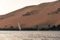 Egyptian Felucca boat cruising in the Nile at Sunset Royalty Free Stock Photo