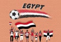 Egyptian football fans cheering with Egypt flag colors in front