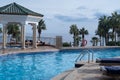 Egyptian garden with palm trees in the hotel. Swimming pool and accommodation in a tropical resort. Buildings, swimming pools and Royalty Free Stock Photo