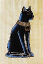 The Egyptian goddess Bastet is depicted on a real Egyptian papyrus Royalty Free Stock Photo