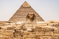 Egyptian Great Sphinx full body portrait head,with pyramids of Giza background Egypt empty with nobody. copy space Royalty Free Stock Photo