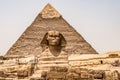 Egyptian Great Sphinx full body portrait head,with pyramids of Giza background Egypt empty with nobody. copy space Royalty Free Stock Photo