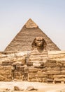 Egyptian Great Sphinx full body portrait head,with pyramids of Giza background Egypt empty with nobody. copy space Royalty Free Stock Photo