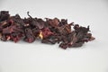 Egyptian hibiscus dry red tea (karkade) aligned pile (line), closeup Royalty Free Stock Photo