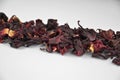 Egyptian hibiscus dry red tea (karkade) aligned pile (line), closeup Royalty Free Stock Photo