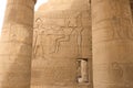 Egyptian hieroglyphs and drawings on the walls and columns. Egyptian language, The life of ancient gods and people in Royalty Free Stock Photo