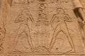 Egyptian hieroglyphs and drawings on the walls and columns. Egyptian language, The life of ancient gods and people in Royalty Free Stock Photo