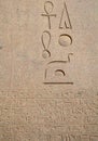 Egyptian hieroglyphs engraved on stone