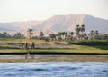 Egyptian landscape with children playing on the bank.