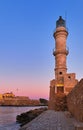Egyptian Lighthouse of Old Venetian harbour of Chania, Crete, Greece at sunrise. Soft sky from blue to pink, vertical