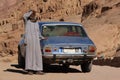 Egyptian man and car near Moses Mountain, Sinai Peninsula, Egypt