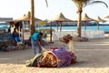 Egyptian man cares for tourist camel