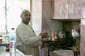 Egyptian man preparing traditional coffee