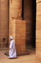 Egyptian man walking by the column, Philae Temple Royalty Free Stock Photo
