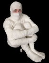 Egyptian mummy emo sitting on a black Royalty Free Stock Photo