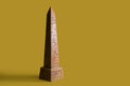Egyptian obelisk symbolizing power on a yellow background