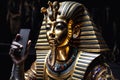 Egyptian Pharaoh Tutankhamen takes selfies.