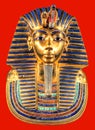 Egyptian pharaoh Tutankhamun burial mask on red background