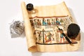 Egyptian scroll, pen, magnifier