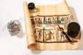 Egyptian scroll, pen, magnifier and treasures in the bag