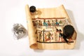Egyptian scroll, pen, magnifier and treasures in the bag on a white background