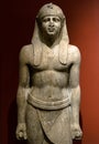 Egyptian statue of pharaoh or high official man, historical stone sculpture. Traditional art of Egypt