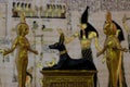 Egyptian statuettes anubis eset nebtht in gold Royalty Free Stock Photo
