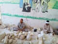 Egyptian stone mine, two men carving stone, alabaster next to local museum, Luxor area, Egypt
