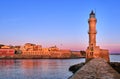 Egyptian or Venetian Lighthouse of Old Venetian harbour of Chania, Crete, Greece at sunrise. Soft sky colors from blue