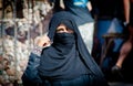 Egyptian woman hidden behind scarf of niqab