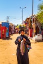 Egyptian woman with souvenirs in the famous Nubian village