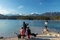 Eibsee, Germany, March 31, 2019: husband taking selfie of his wife for instagram at eibsee