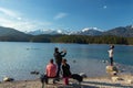 Eibsee, Germany, March 31, 2019: husband taking selfie of his wife for instagram at eibsee