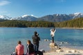 Eibsee, Germany, March 31, 2019: husband taking selfie of his wife for instagram at eibsee