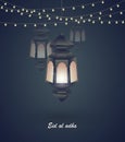 Eid al adha. Greeting card template on Eid Al-Fitr muslim religious holiday with lanterns on blurred lights background