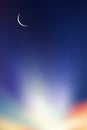 Eid al Adha Mubarak card,Crescent Moon on Blue Twilight Sky in Evening,Vertical Sunset after sundown,Dusk sky with copy space,