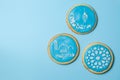 Eid Al-Adha Mubarak holiday concept - blue cookies with stenciled pictures