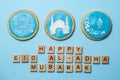 Eid Al-Adha Mubarak holiday concept - blue cookies with stenciled pictures