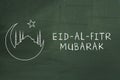 Eid-Al-Fitr mubarak text on green blackboard. Welcoming ramadan. Royalty Free Stock Photo