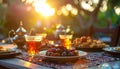 Eid Celebration with Traditional Tea and Dates at Sunset Outdoor Setting Royalty Free Stock Photo