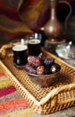 Eid mubarak with arabic coffee pot and dates. Dried dates and coffe