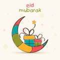 Eid Mubarak celebration greeting card with moon and gift.