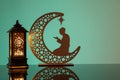 Eid Mubarak concepts with lamp inscribed with arabic text translated to english as Ramadhan is our light., with crescent