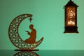 Eid Mubarak concepts with lamp inscribed with arabic text translated to english as Ramadhan is our light., with crescent