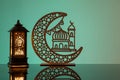 Eid Mubarak concepts with lamp inscribed with arabic text translated to english as Ramadhan is our light., with crescent